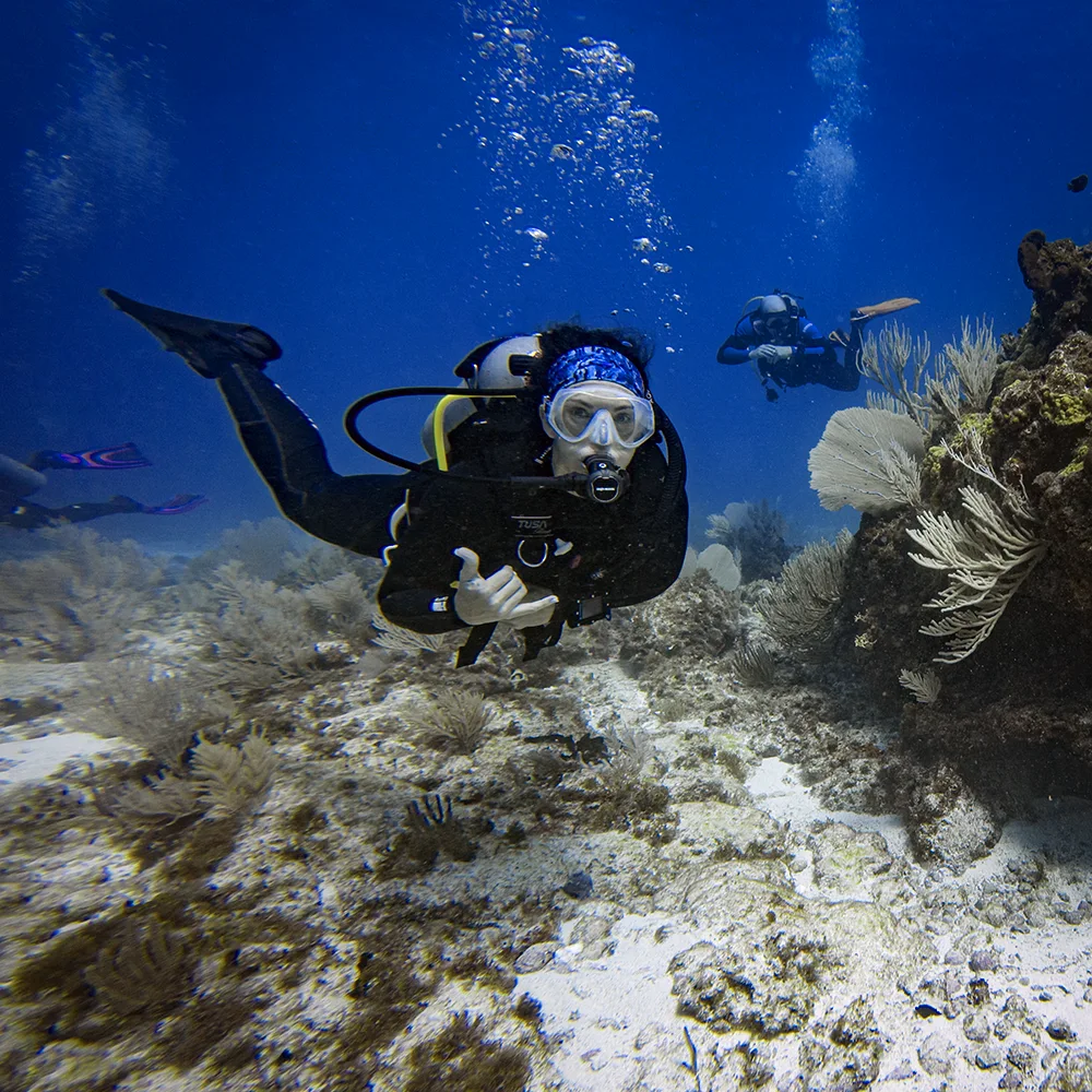Scuba diver posing for a photo at Manchones Grande Reef in Cancun.